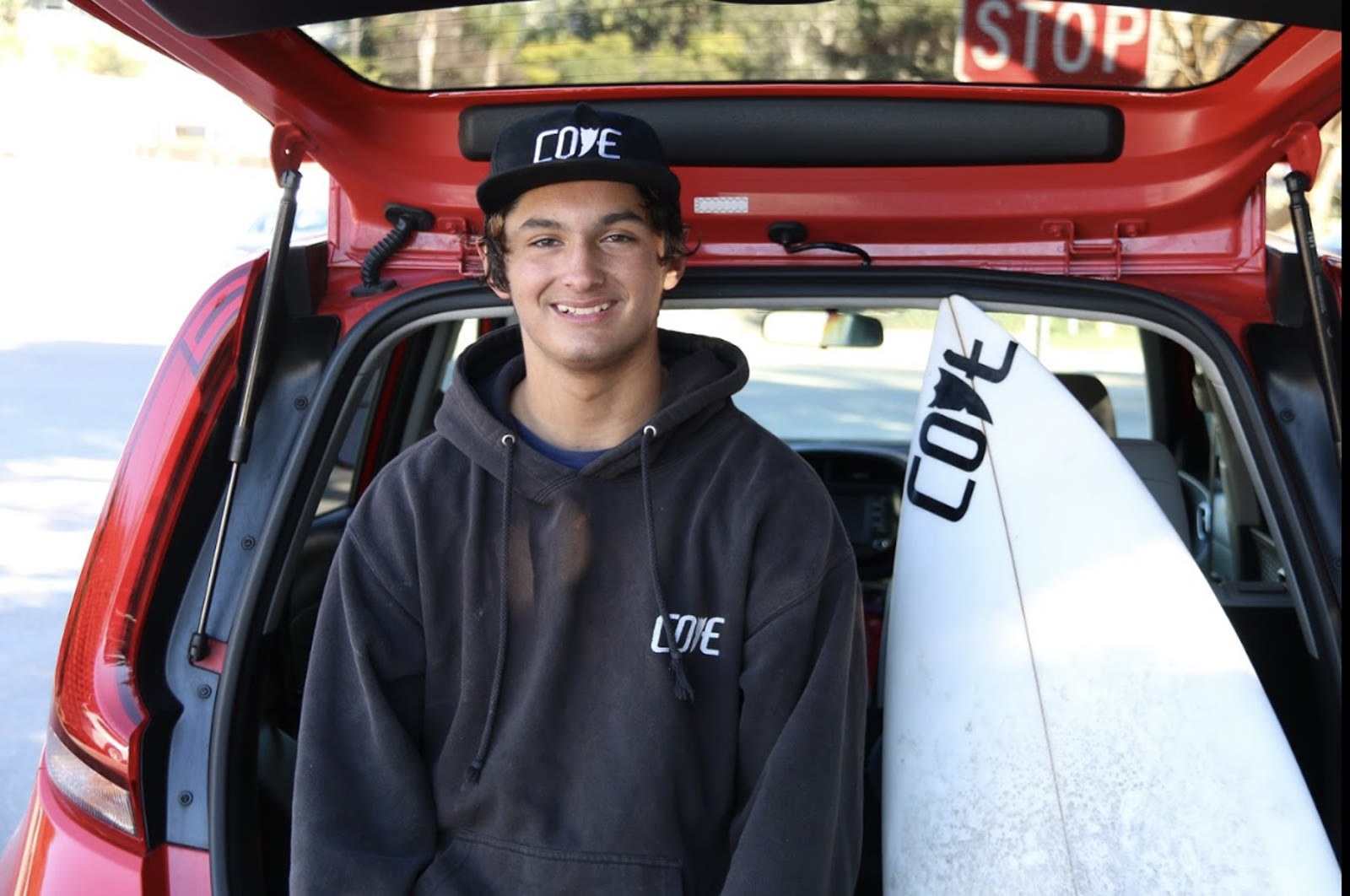 Ari Engel with his surfboard